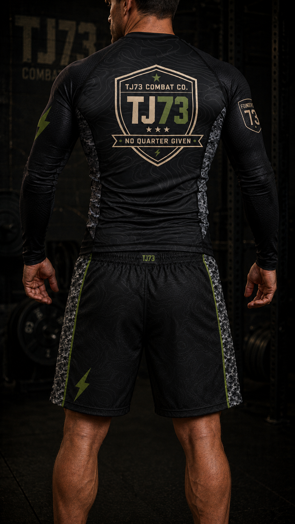 Athlete wearing TJ73 Combat Co. long sleeve rashguard, back view with TJ73 shield