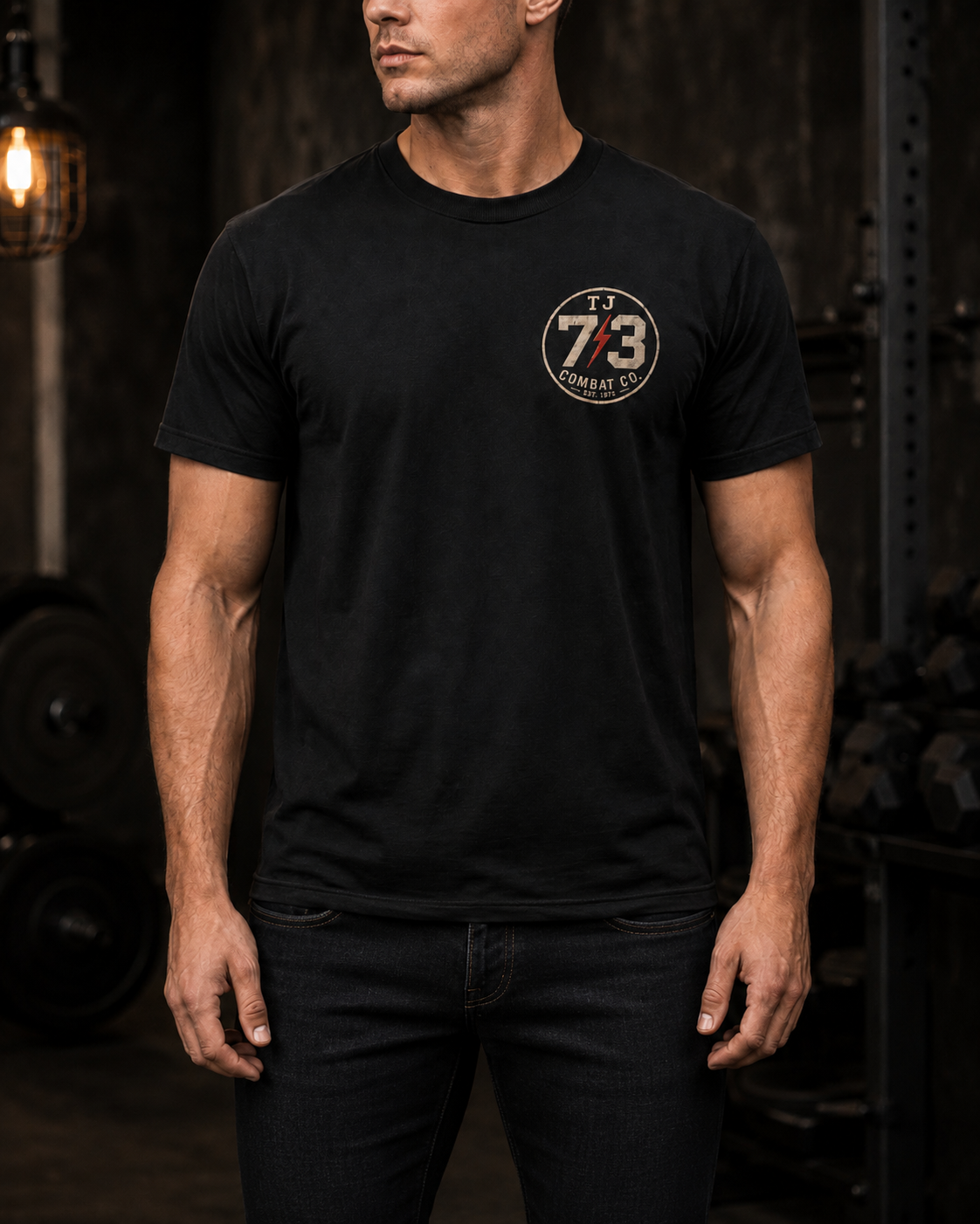 Man wearing TJ73 Combat Company Tee with jeans, front view with left-chest TJ73 circle patch